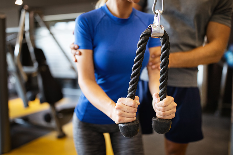 happy-fit-woman-exercising-with-her-personal-trainer Bournemouth